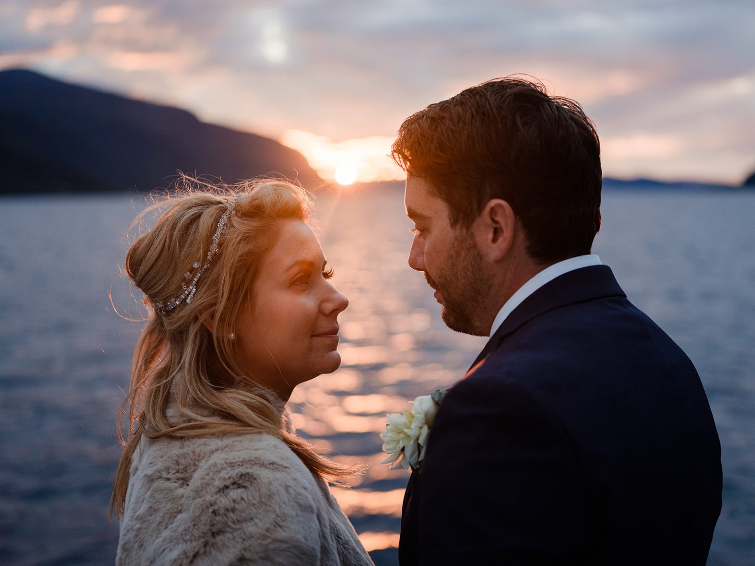Bride and groom at golden hour on the boat