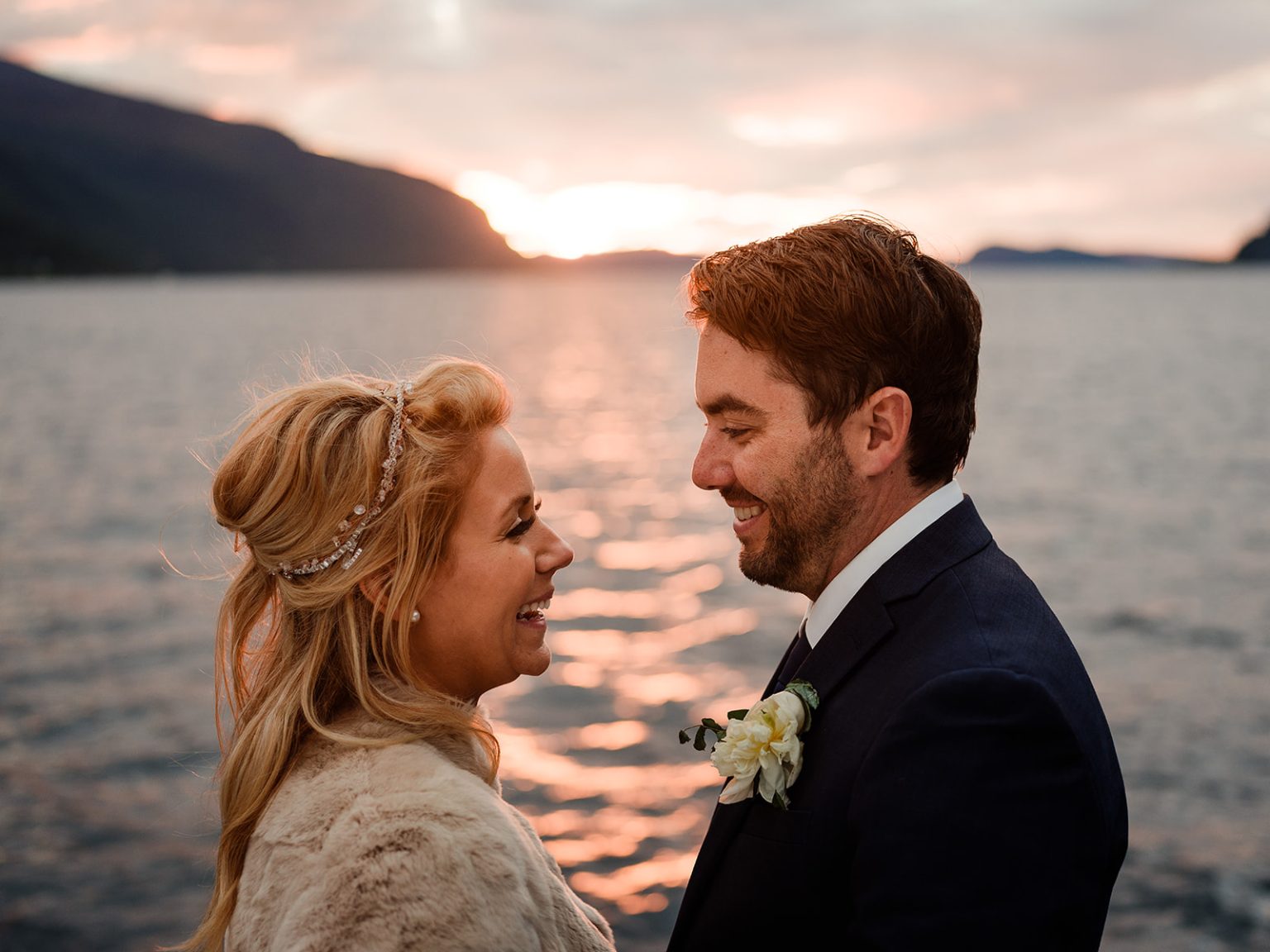 Bride and groom at sunset on the fjord, Hotel Union Øye wedding