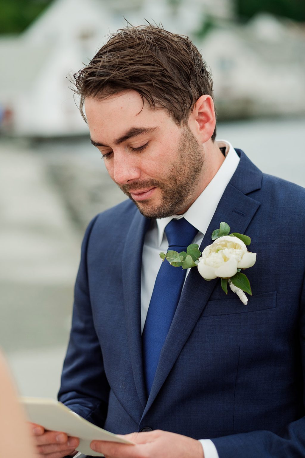 Groom reading his vows by the water, Ålesund elopement