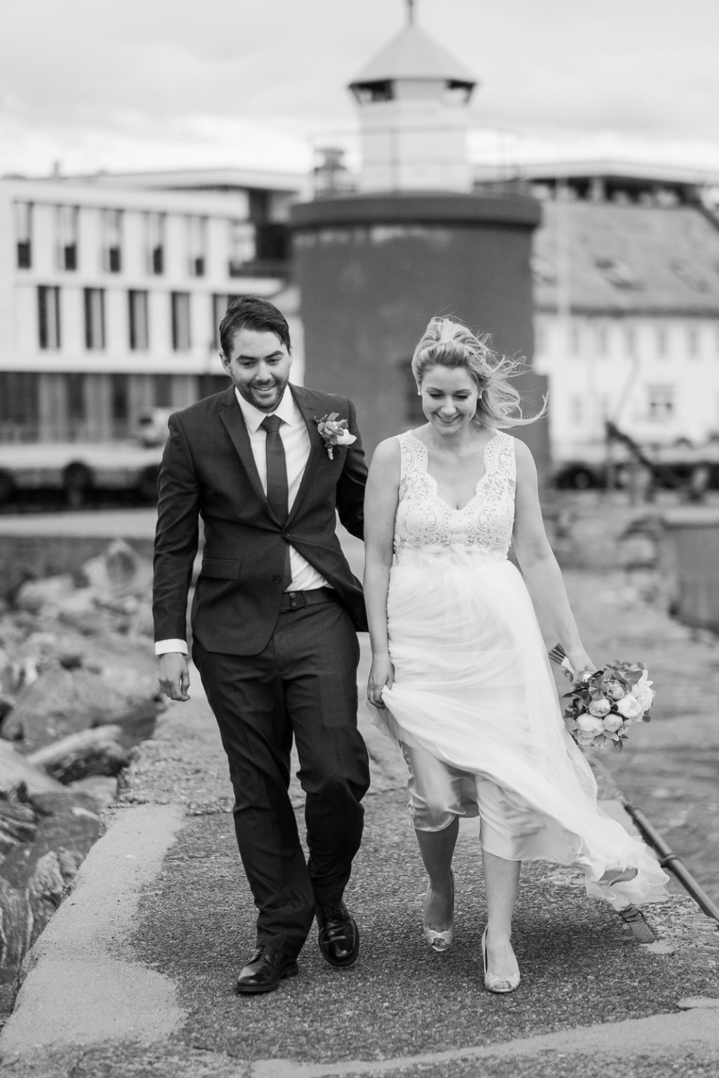 Bride and groom walking through Ålesund, black and white