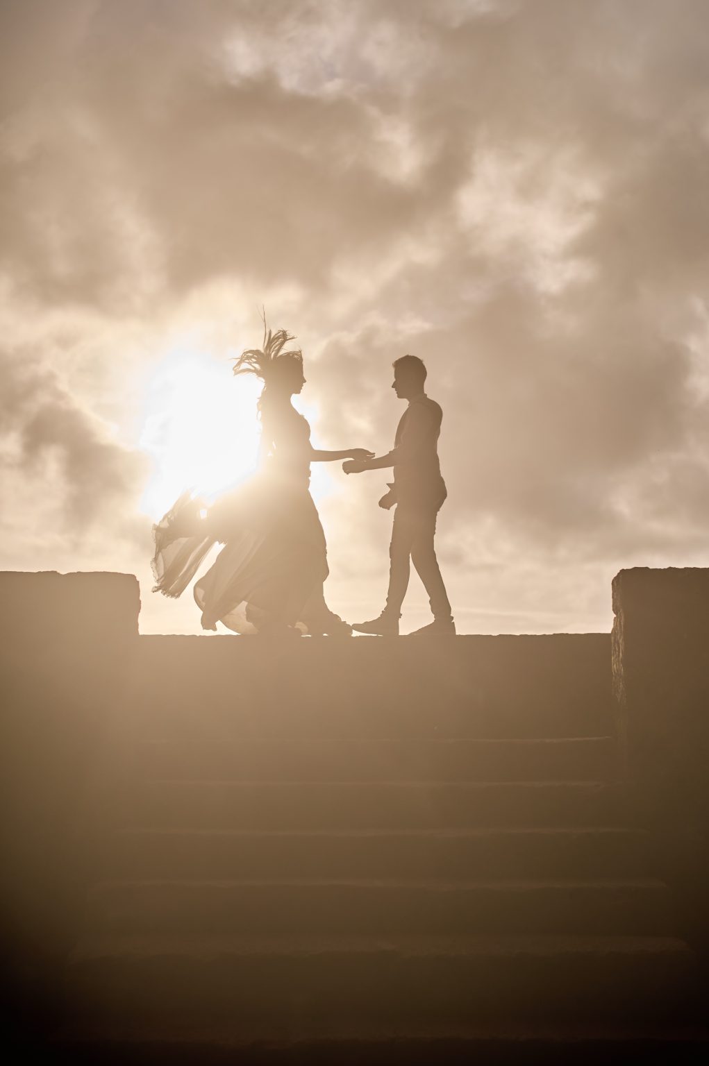 Silvia and Florin in silhouette at sunset, São Miguel