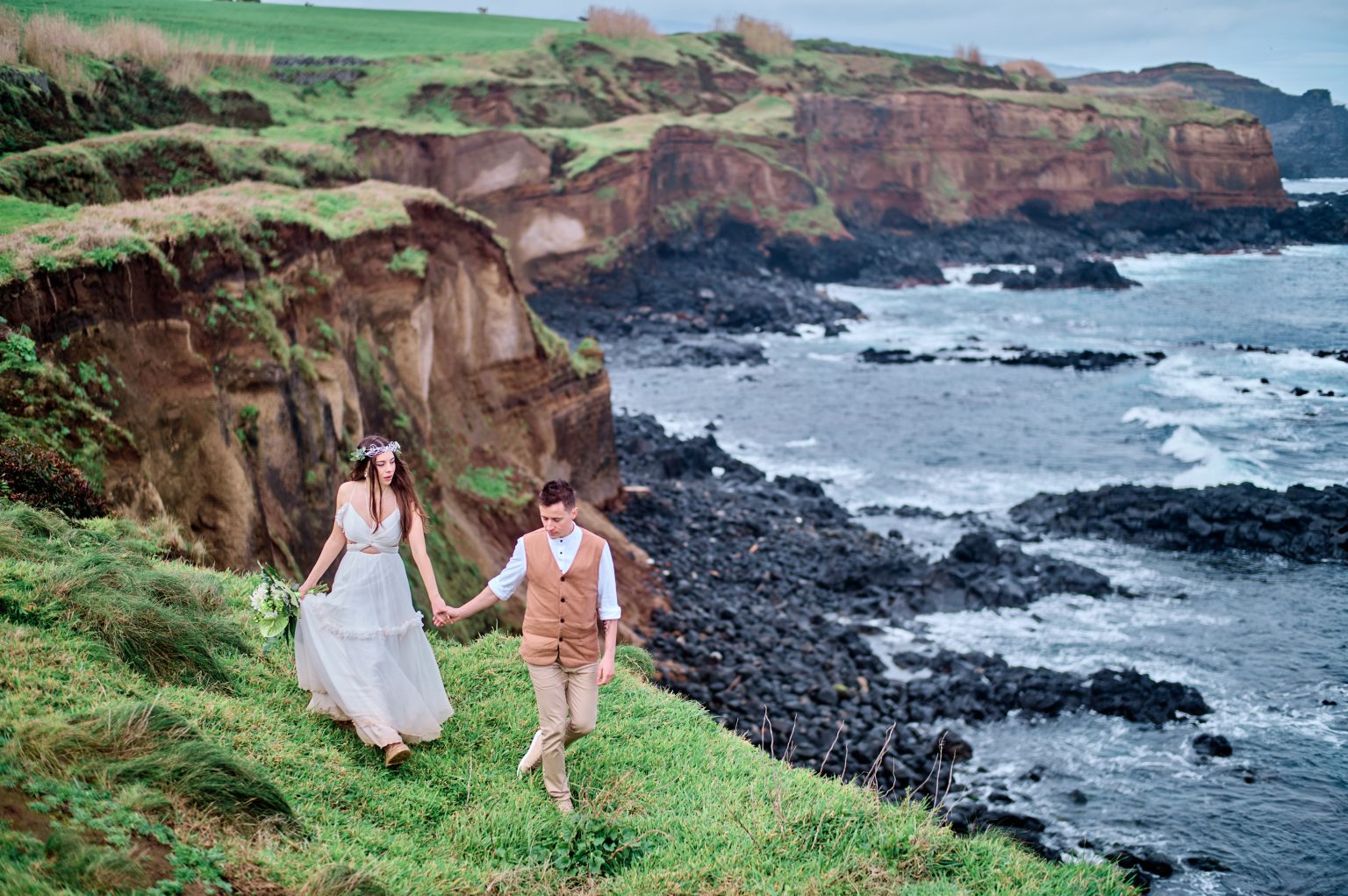 Red coastal cliffs and the sea on São Miguel