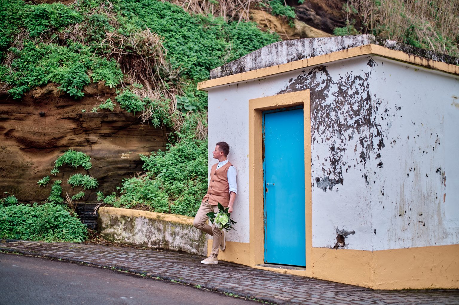 A white Azorean house with a blue door on São Miguel
