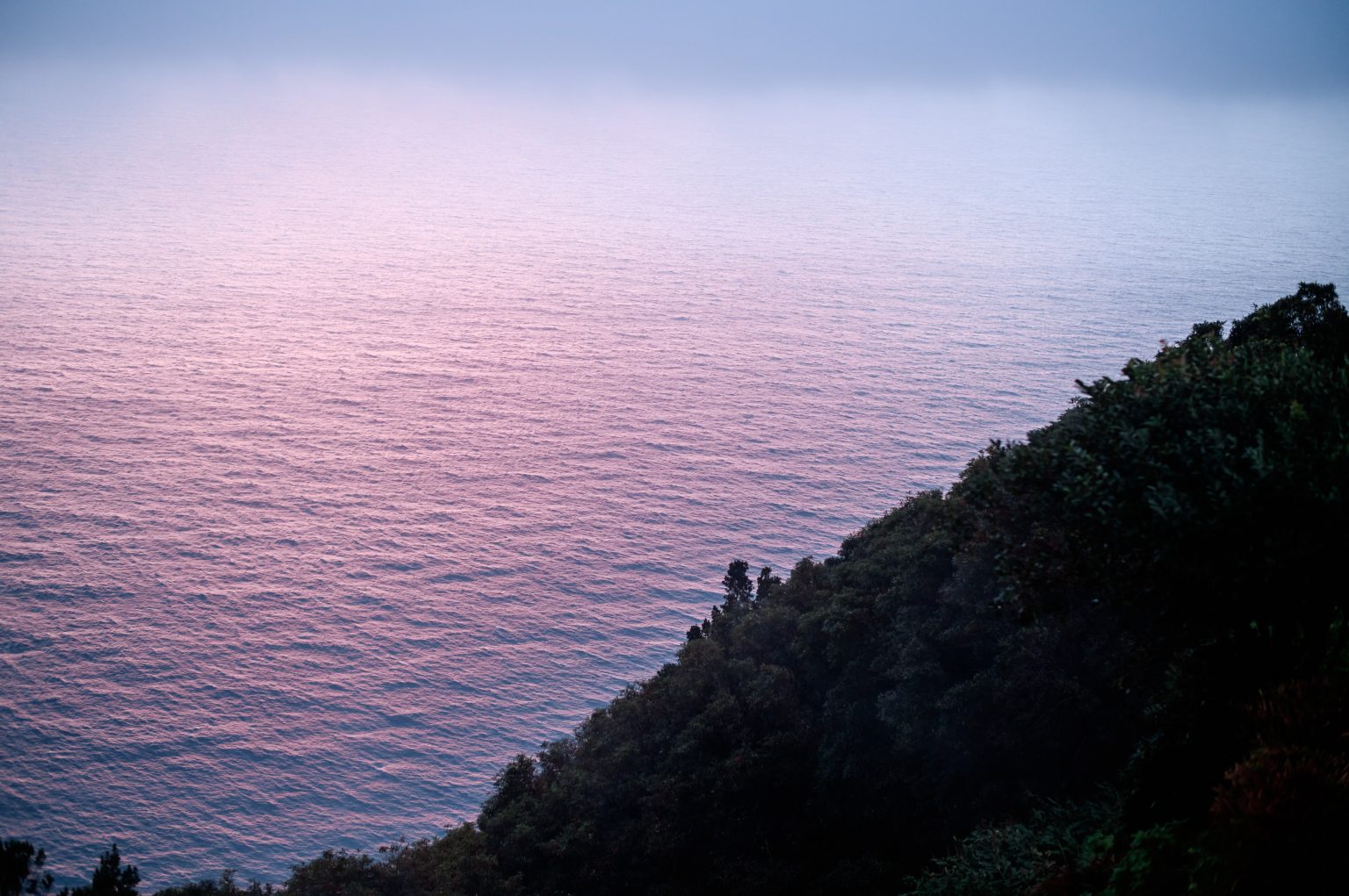 Sunset over the ocean from a São Miguel miradouro