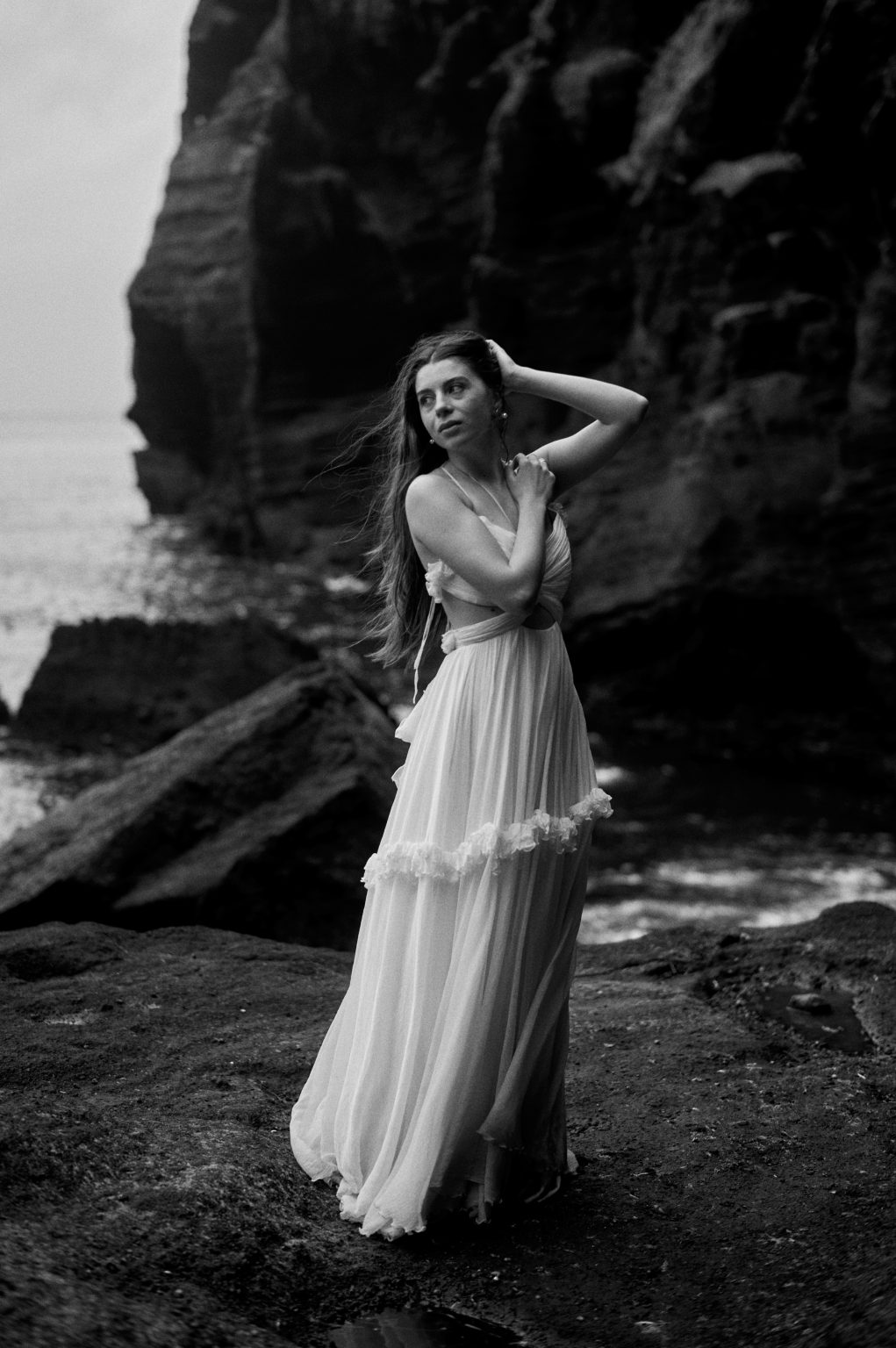 The bride on a black beach below a sea stack, São Miguel