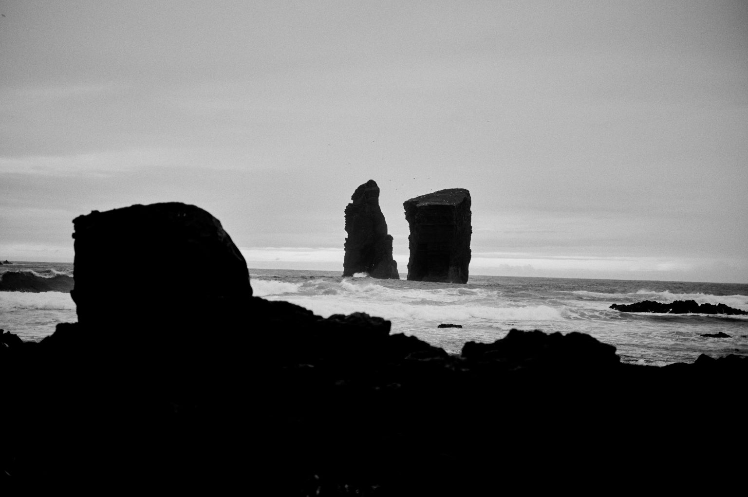 The sea stacks of Mosteiros in silhouette, São Miguel