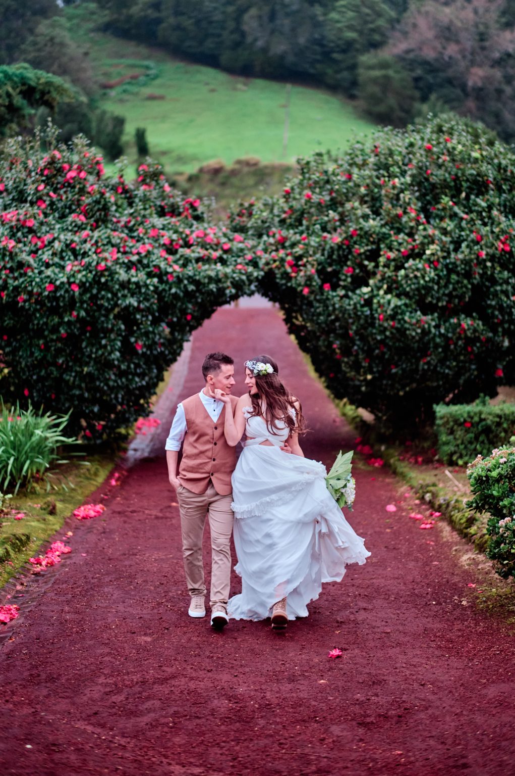 Silvia and Florin walking a red garden path, São Miguel