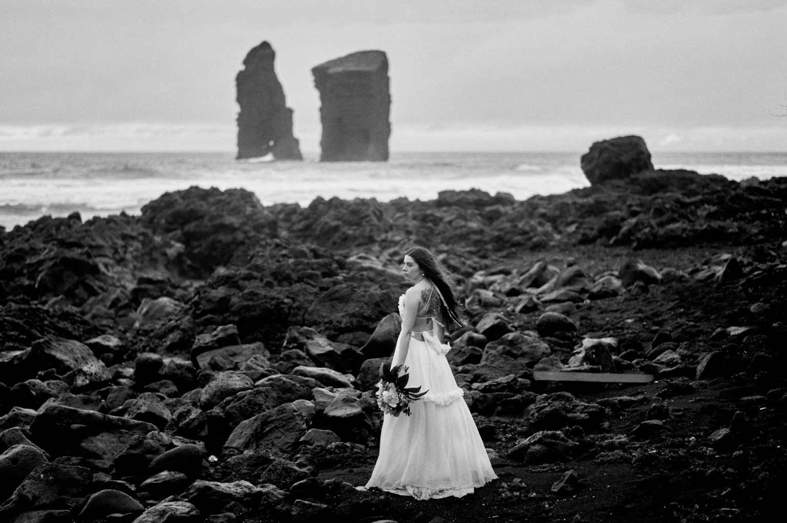 Bride on the black rocks at Mosteiros, black and white