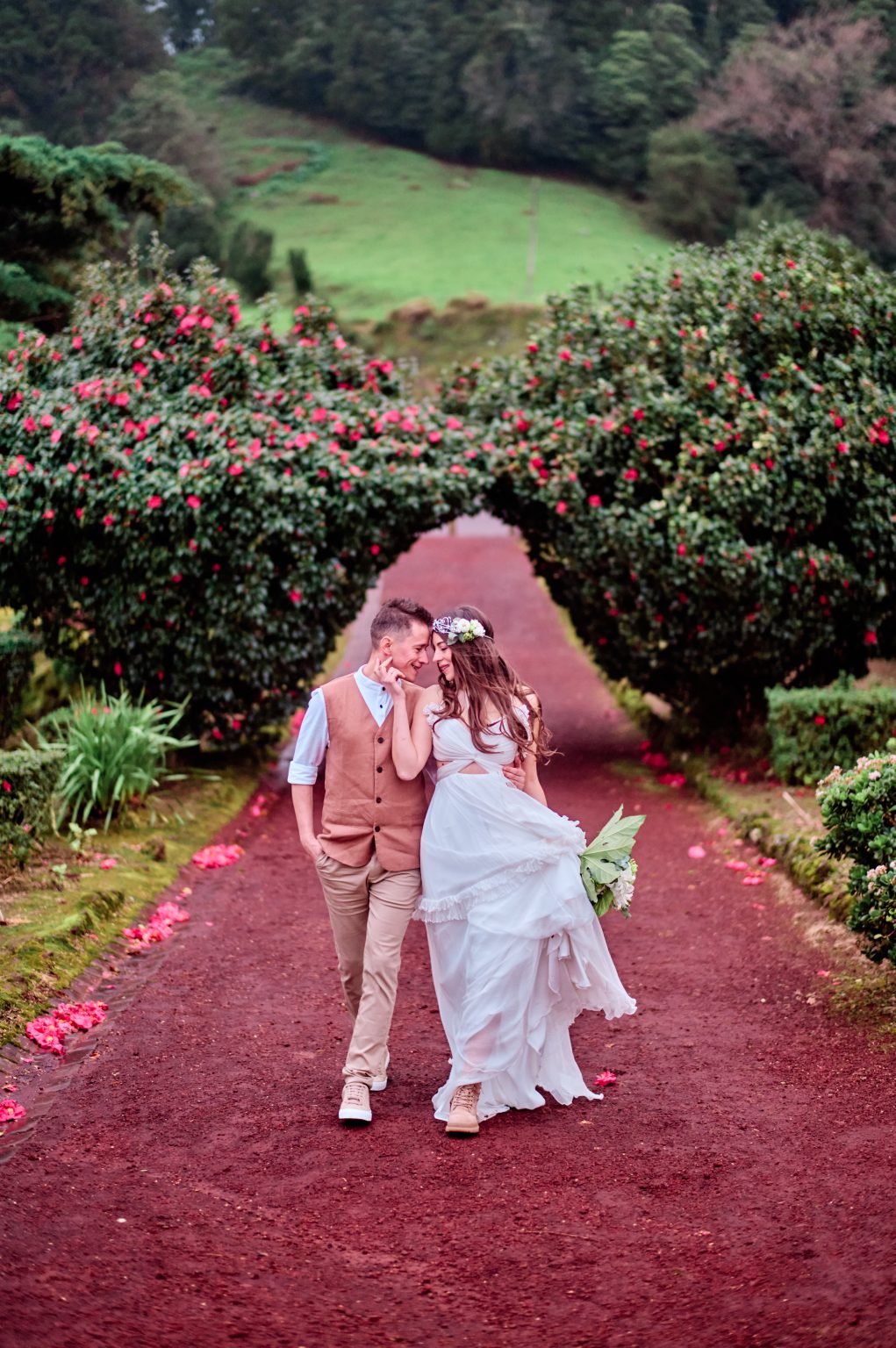 The couple on a flowering garden path in the Azores