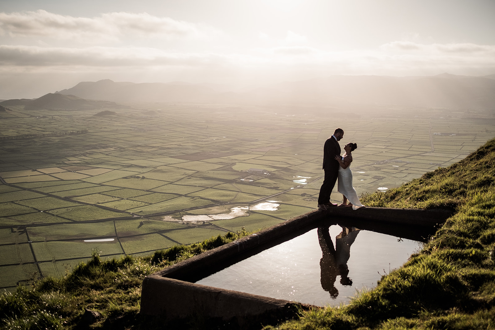 A couple at a viewpoint over the patchwork fields of Terceira