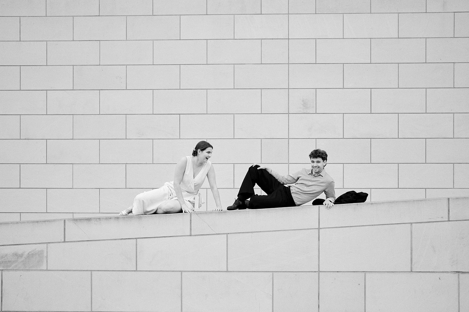 Couple on the steps in Berlin, a black and white engagement session - Nordica Photography