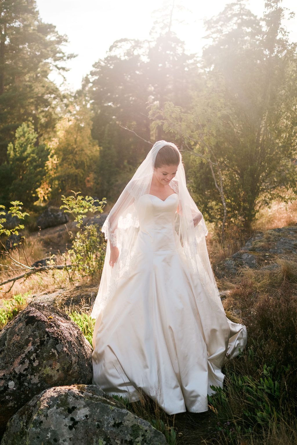 Bride at golden hour by the water