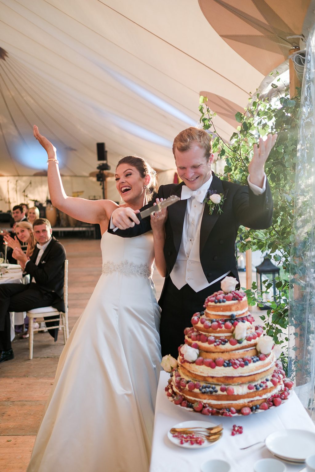 Bride and groom cutting the cake