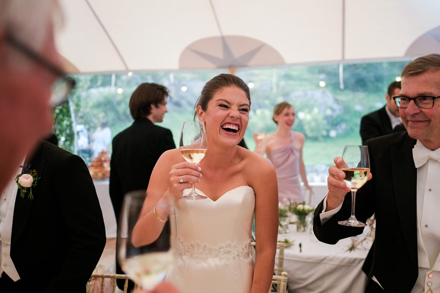 Bride laughing during the speeches
