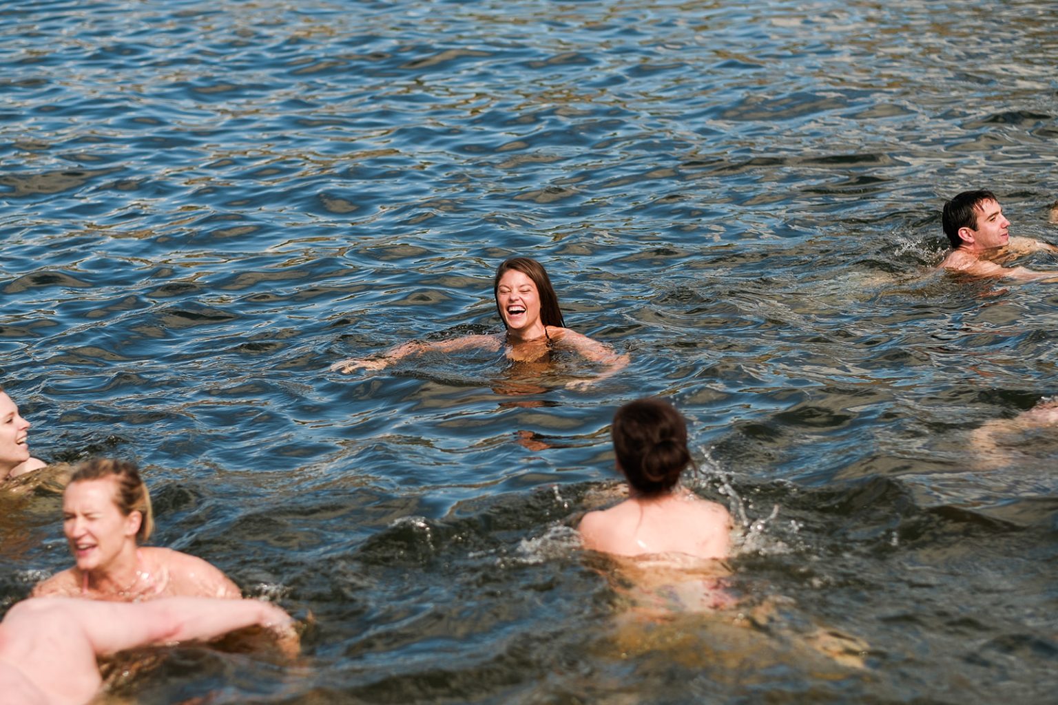 Wedding guests swimming in the Stockholm archipelago