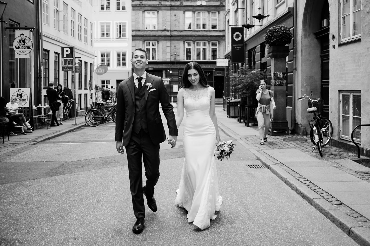Bride and groom walking a Copenhagen street