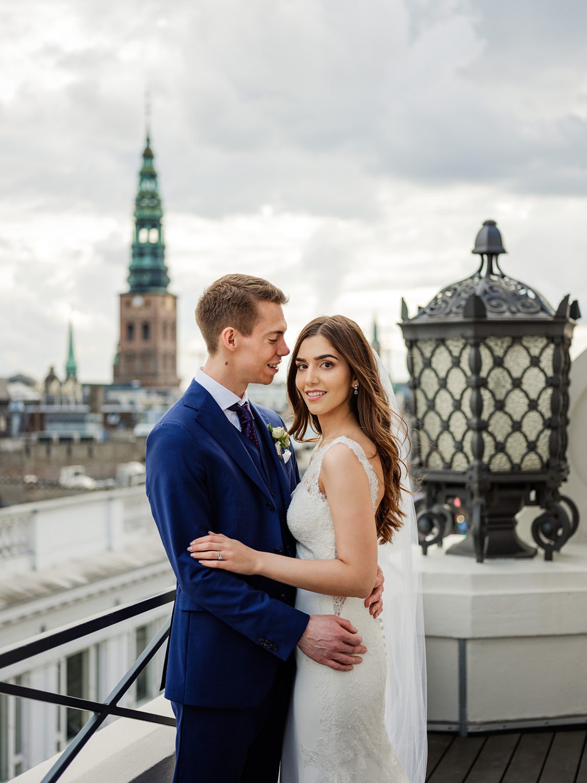 Bride and groom above the Copenhagen skyline