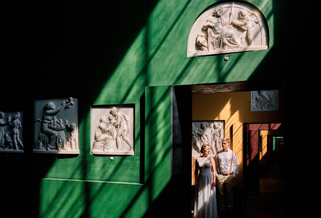 Caroline and Rasmus among the reliefs at Thorvaldsens Museum, Copenhagen engagement photographer