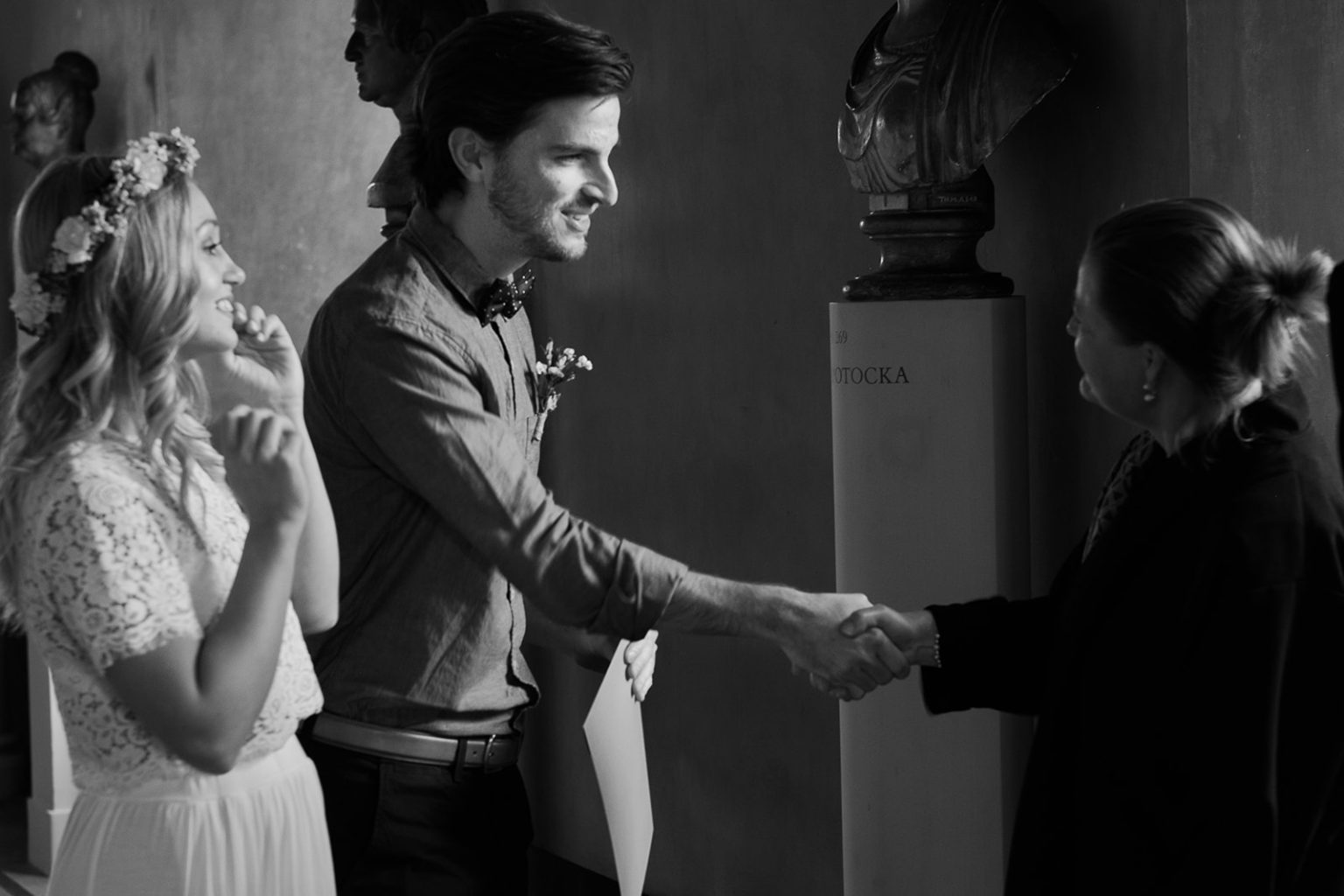 Shaking hands with the officiant after the ceremony