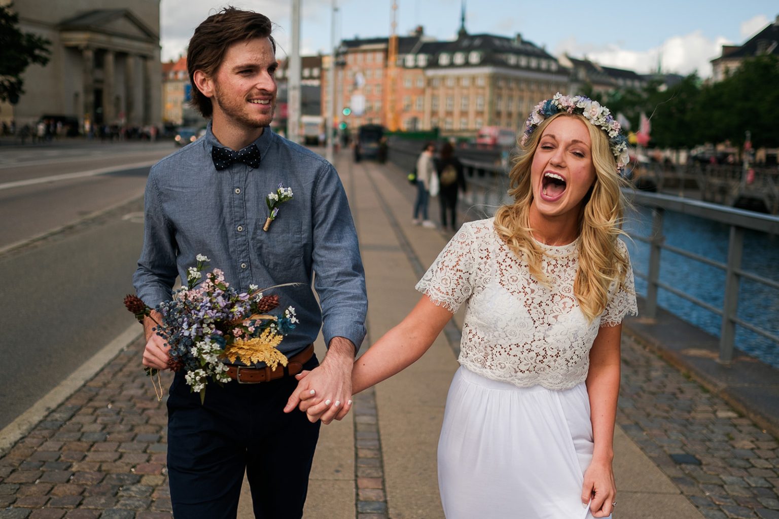 The couple laughing on a Copenhagen street