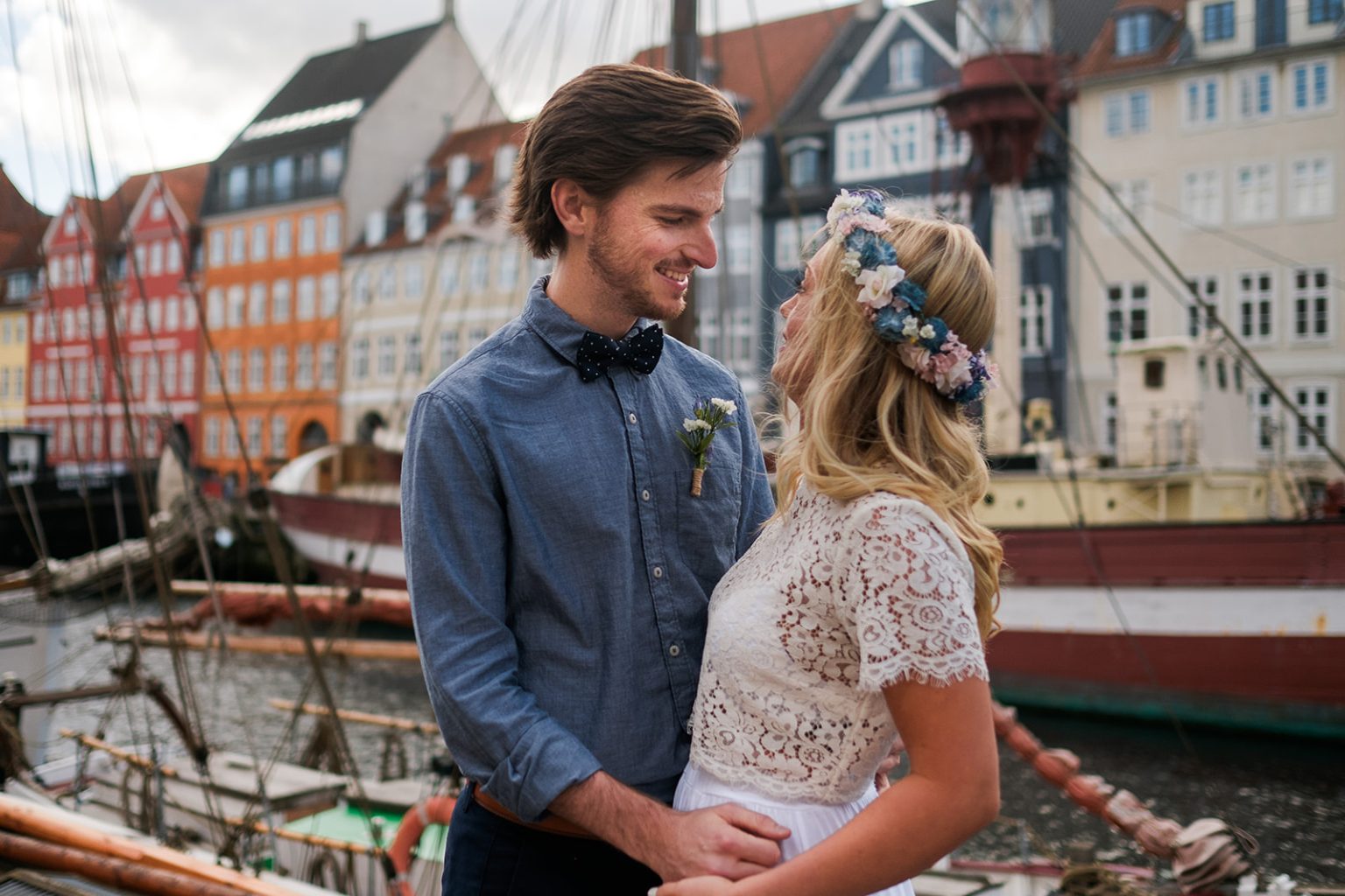 Bride and groom by the canal at Nyhavn, Copenhagen