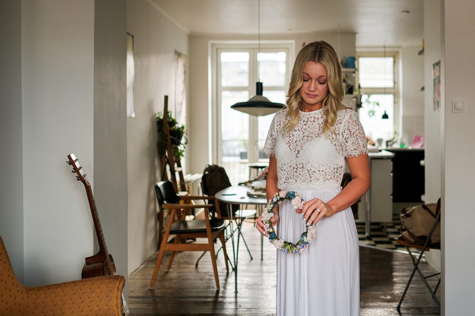 The bride in window light before her Copenhagen elopement