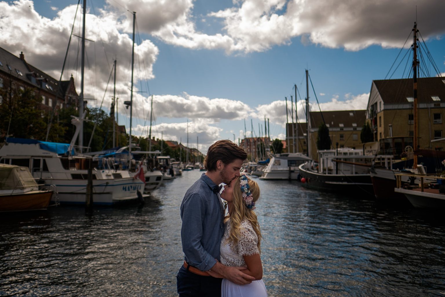 Bride and groom embracing on a canal boat