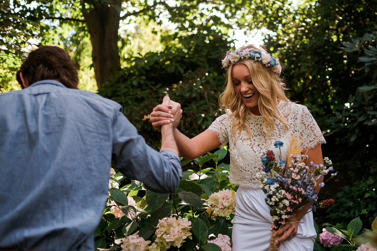 Bride and groom holding hands in the Tivoli gardens