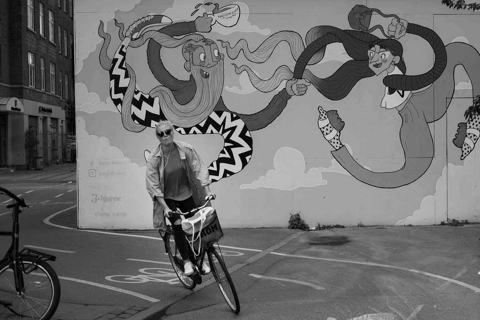 A cyclist and a street mural in Copenhagen