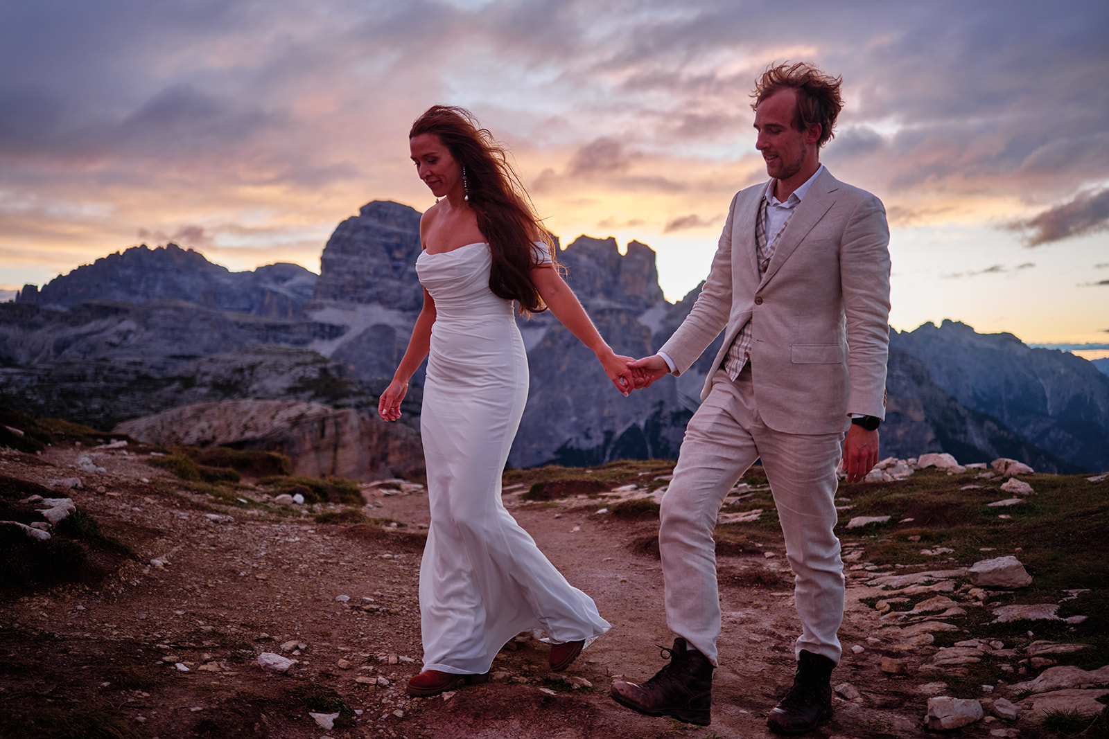 Bride and groom below Tre Cime di Lavaredo at dawn