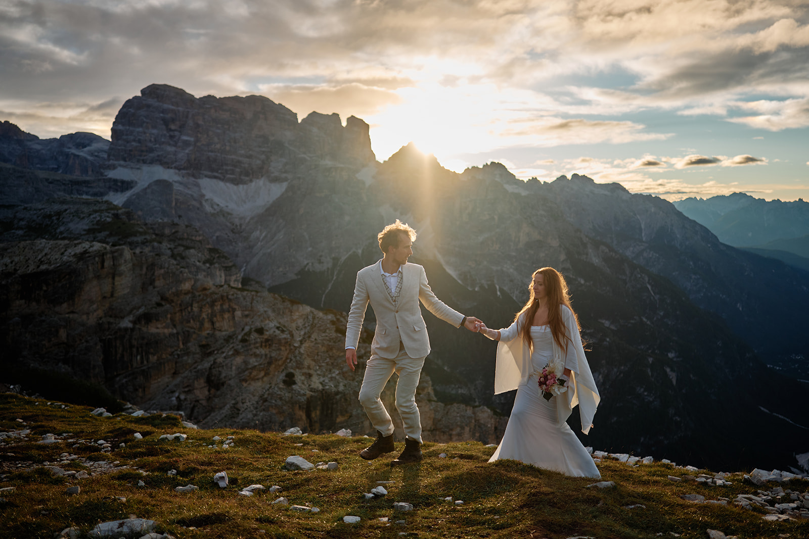 Bride and groom below Tre Cime di Lavaredo at dawn