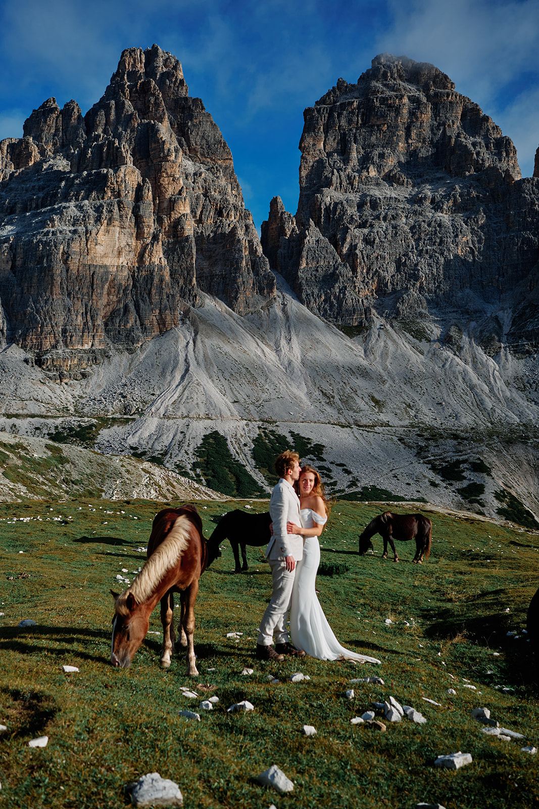 Horses crossing the meadow at a Tre Cime wedding