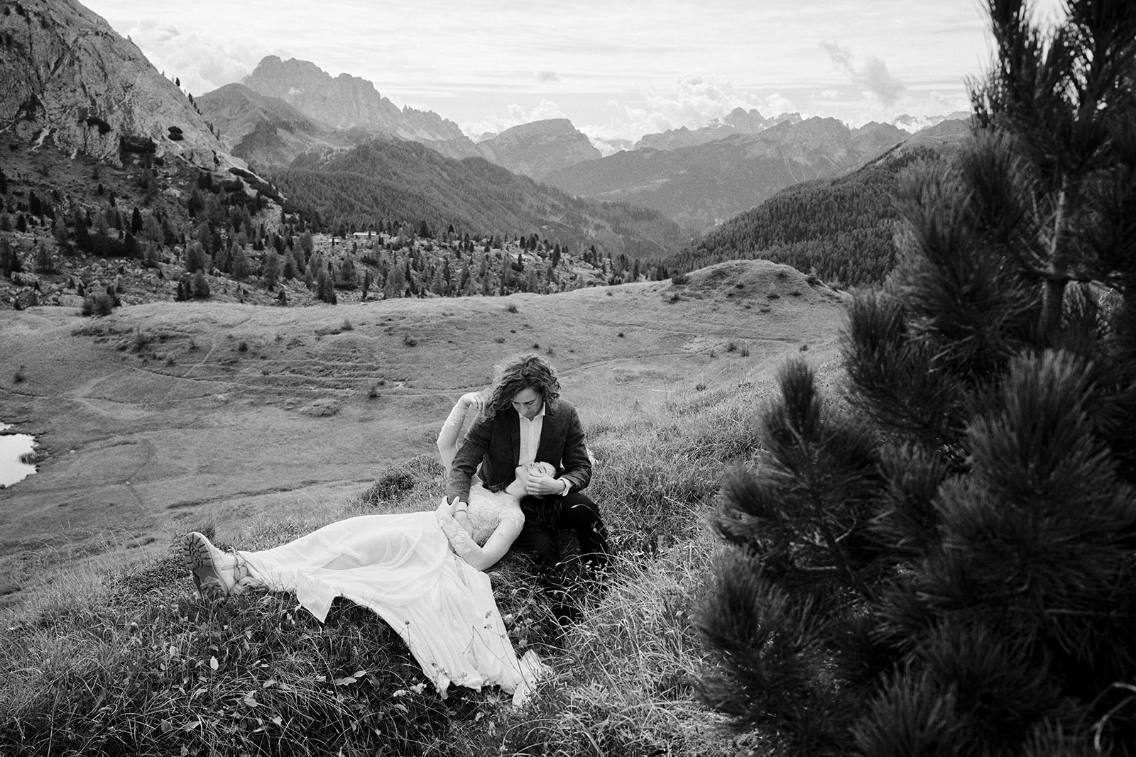 Bride and groom in the meadows above Passo Giau