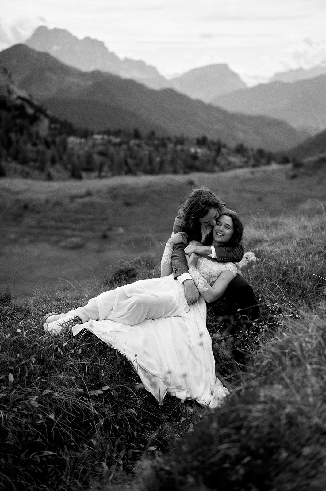 Eloping couple in the meadows above Passo Giau