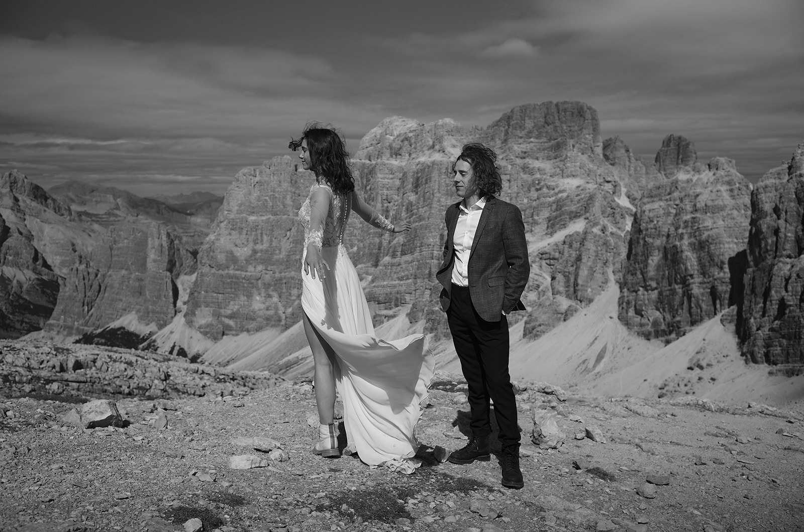 Eloping couple in the meadows above Passo Giau