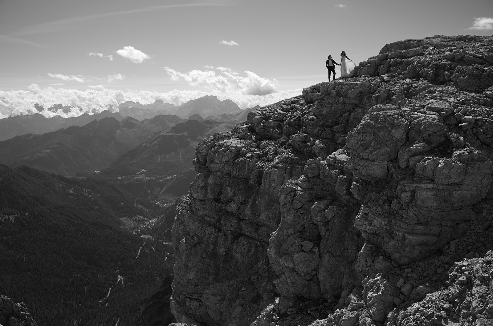 Black and white photograph of a couple at Rifugio Lagazuoi in the Dolomites