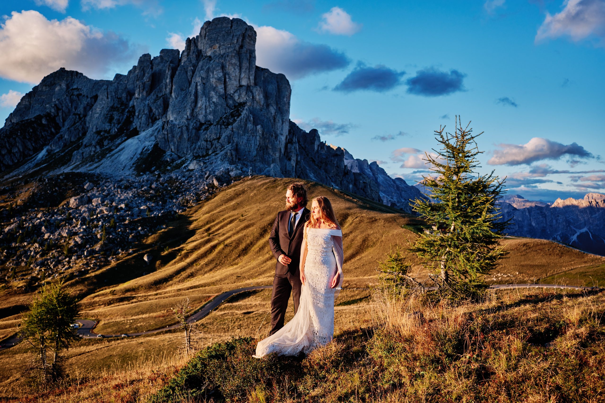 Peter & Moa beneath Ra Gusela, golden hour at Passo Giau
