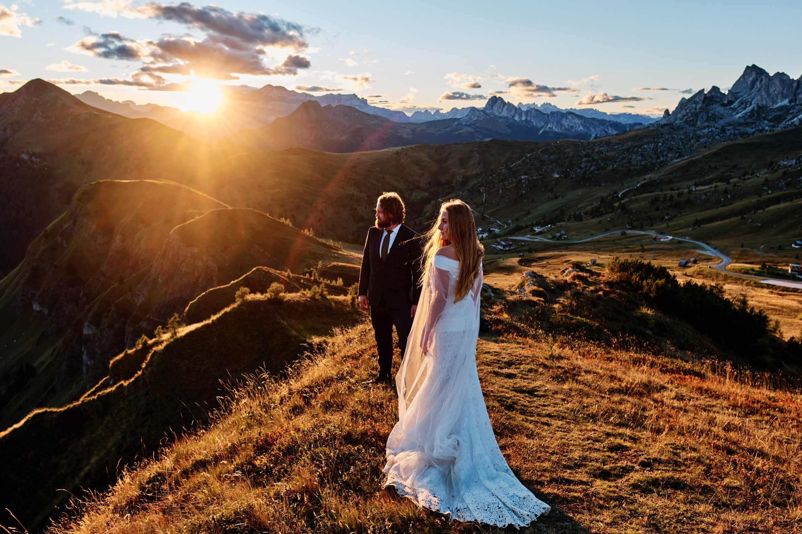Couple on the ridge at sunset, Passo Giau, Dolomites