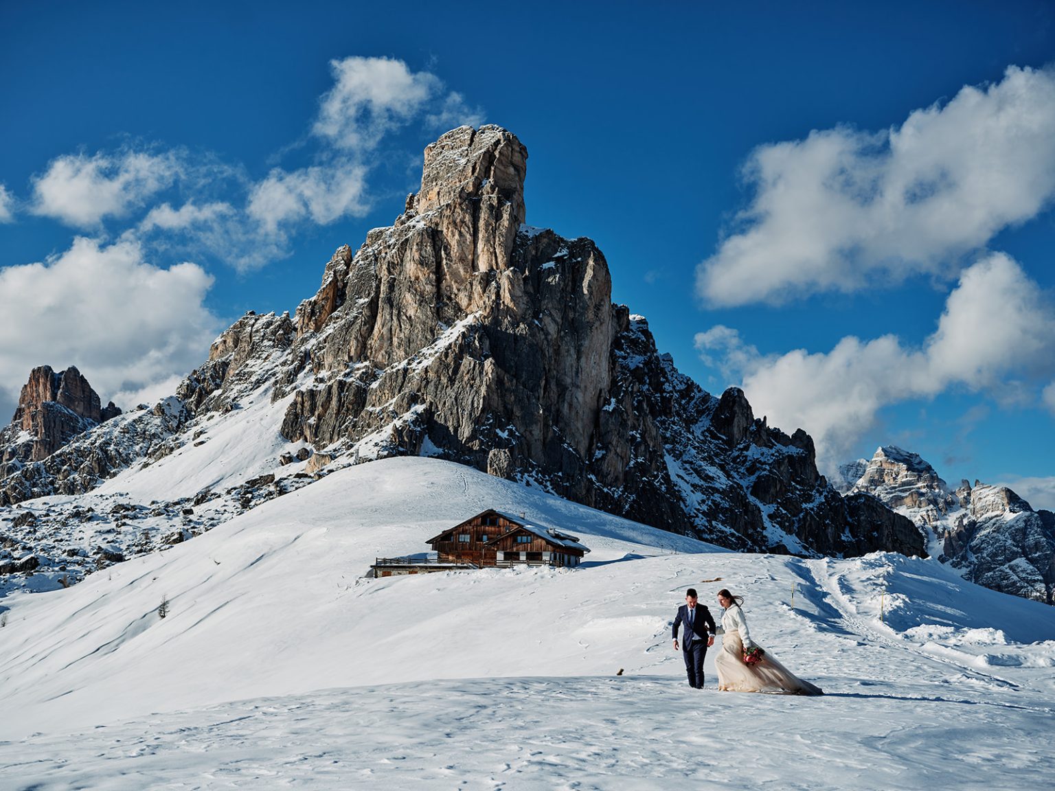 The pyramid peak of Ra Gusela above snowy Passo Giau, the Dolomites