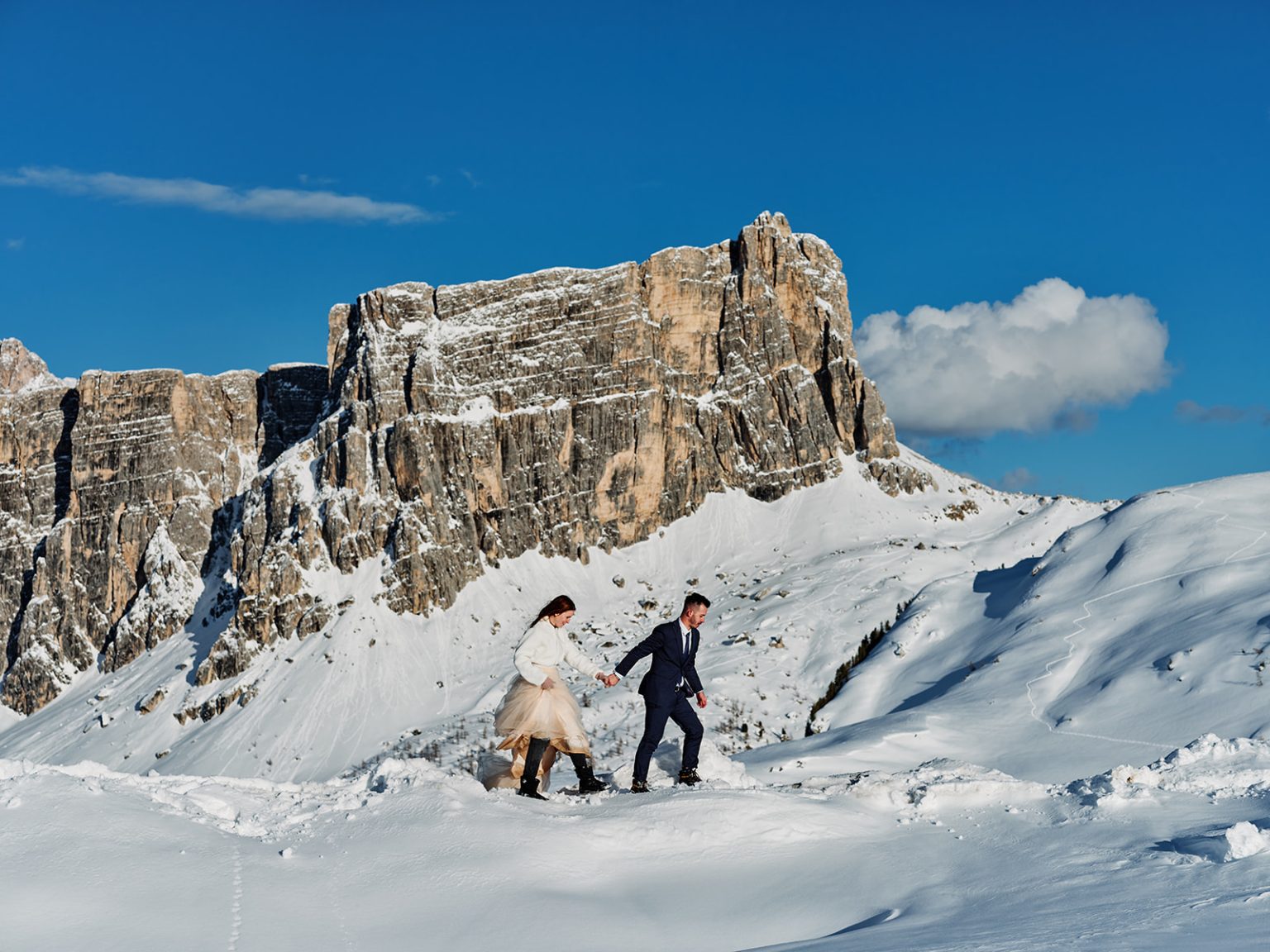 Kristina and Cristian at the Cinque Torri in winter, the Dolomites