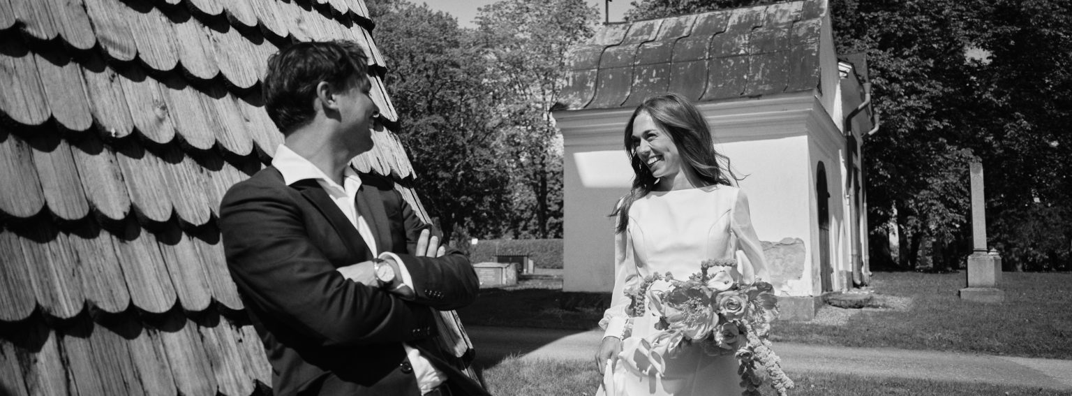 Elopement couple by a shingled wooden chapel, Söderhamn