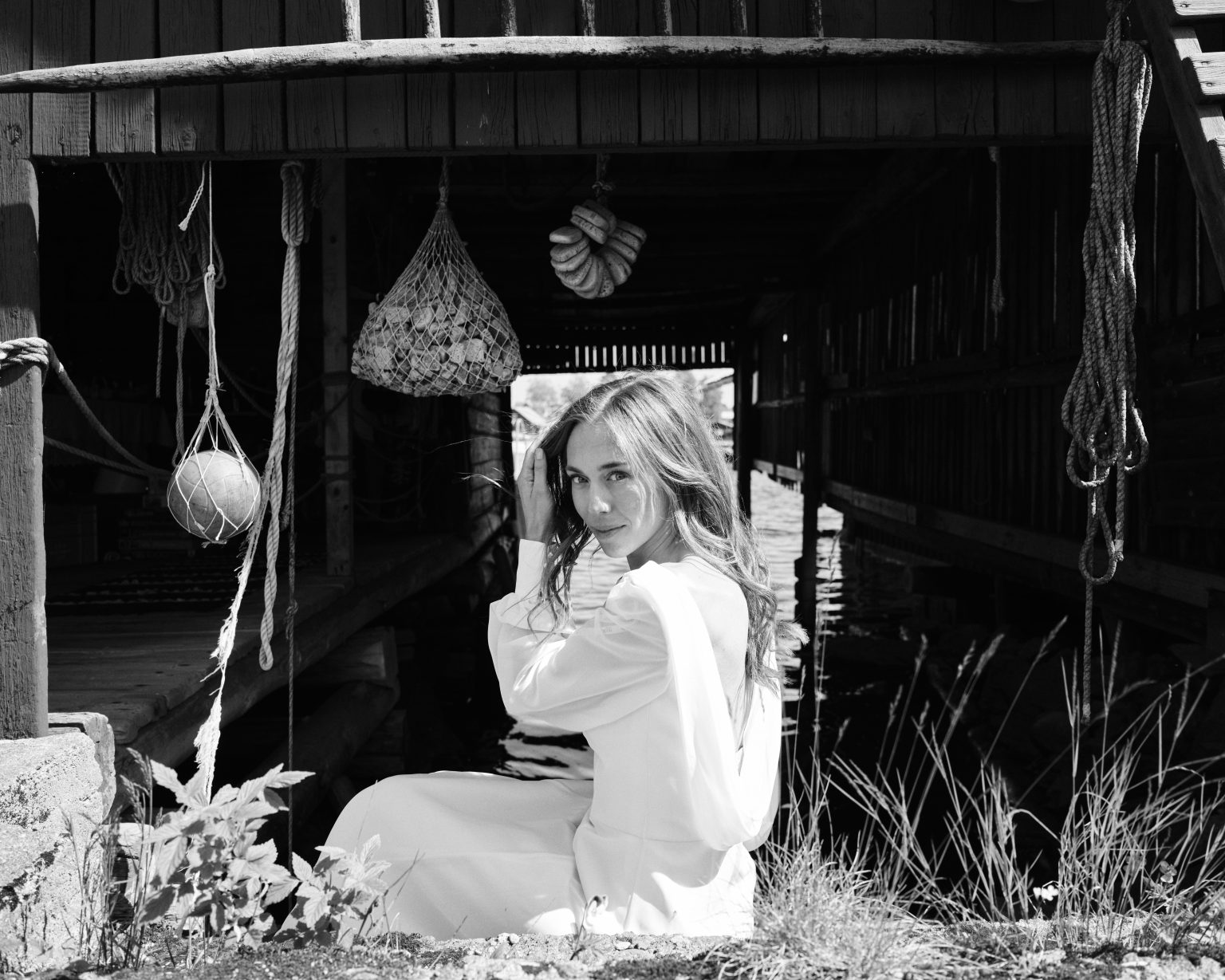 Elin by the fishing floats in the village of Skärså