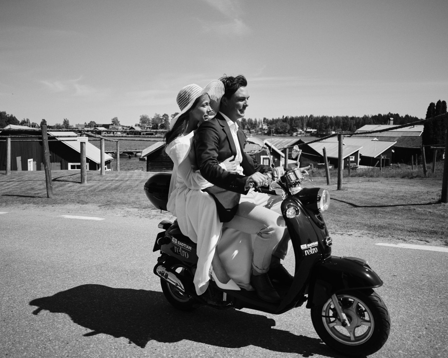 The couple on their moped along a village lane on the Hälsingland coast