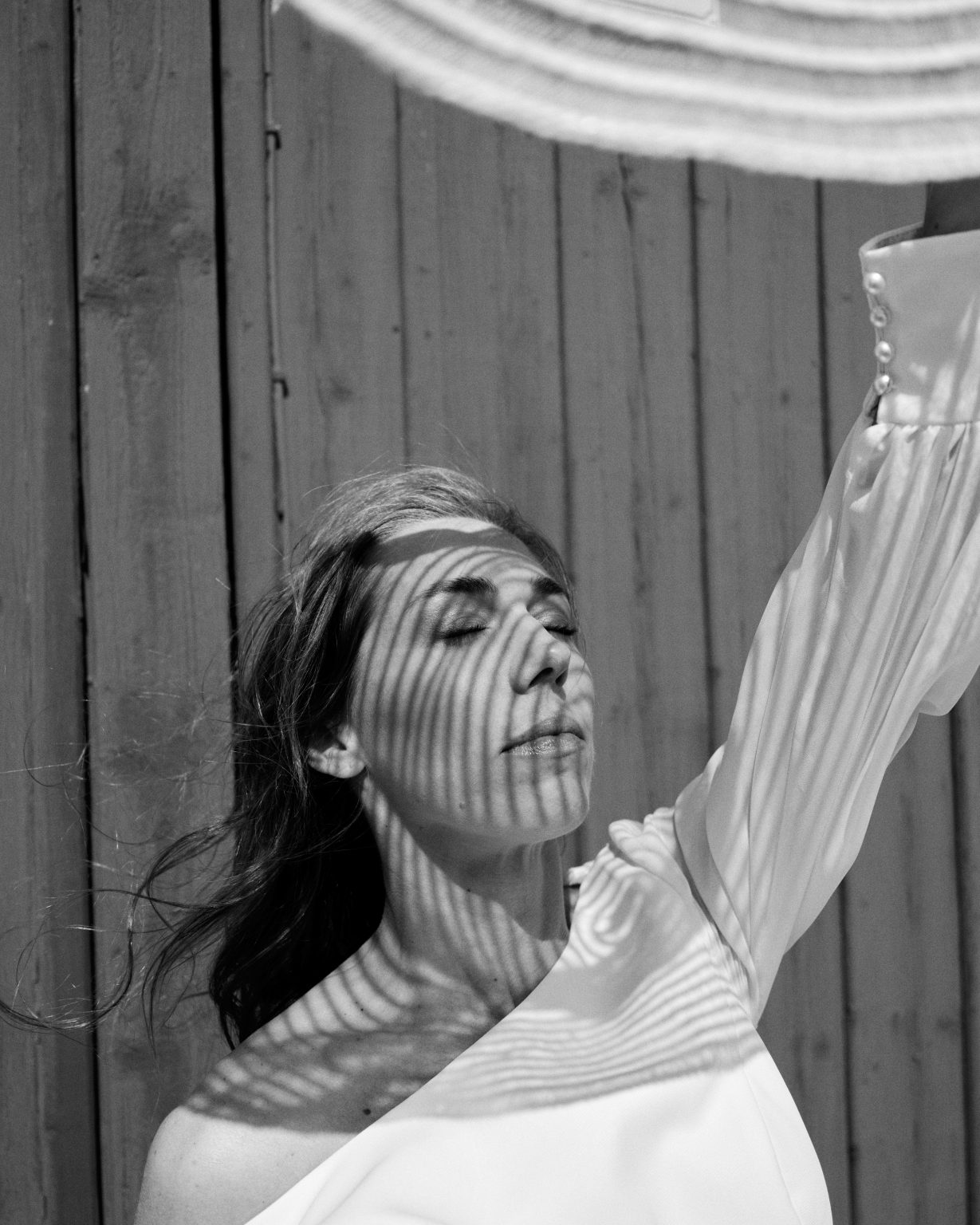 Bride portrait with striped shadow across her face, Skärså