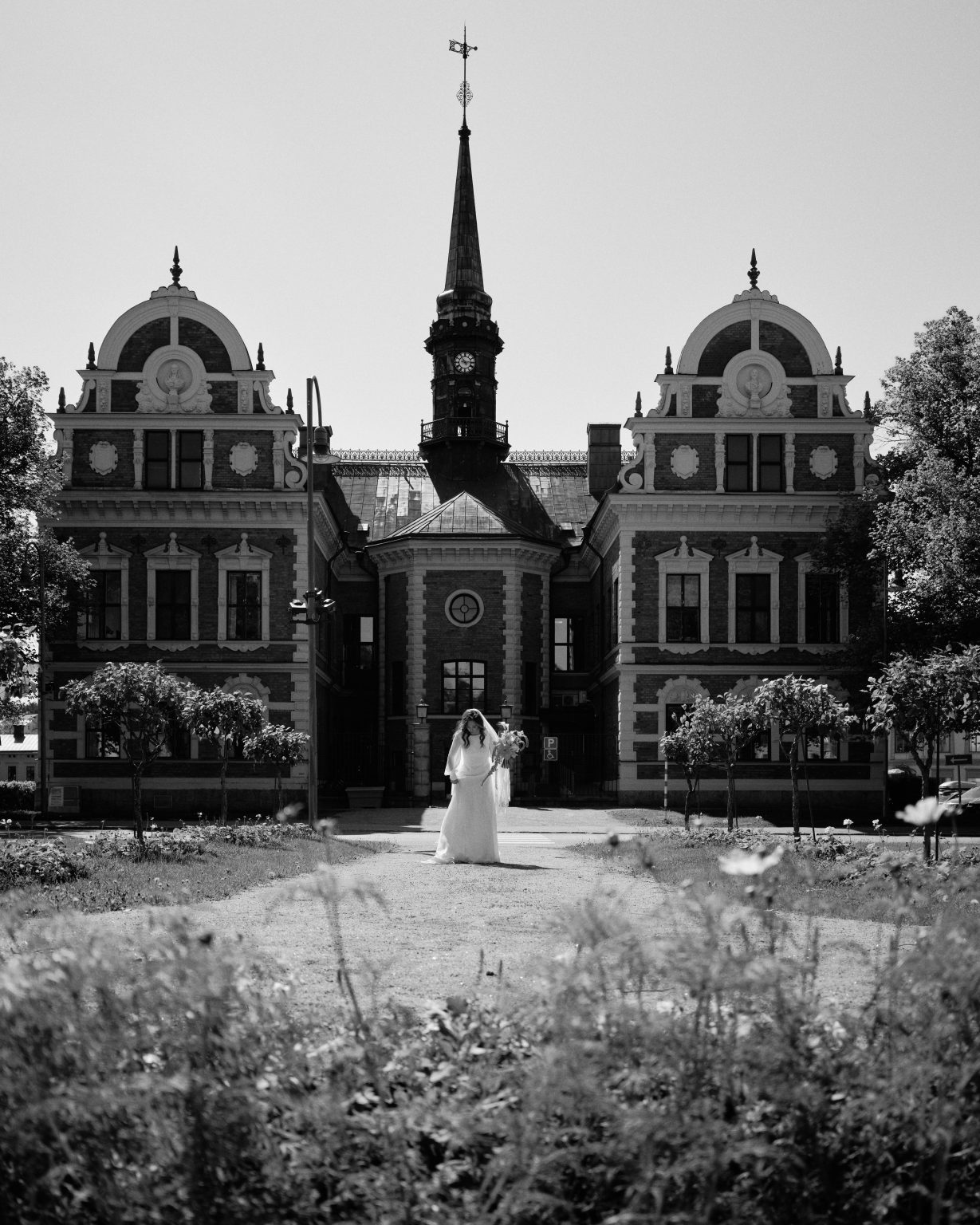 Bride standing in front of the Söderhamn landmark before the ceremony