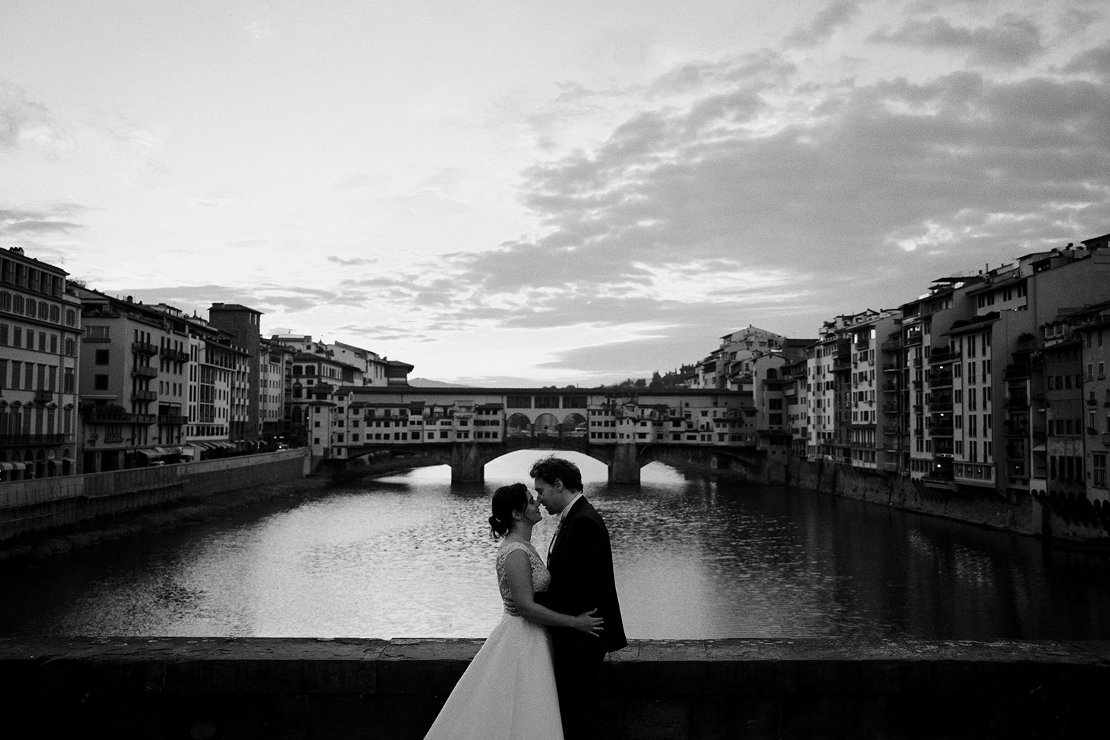 Ponte Vecchio reflected in the Arno at sunrise in Florence