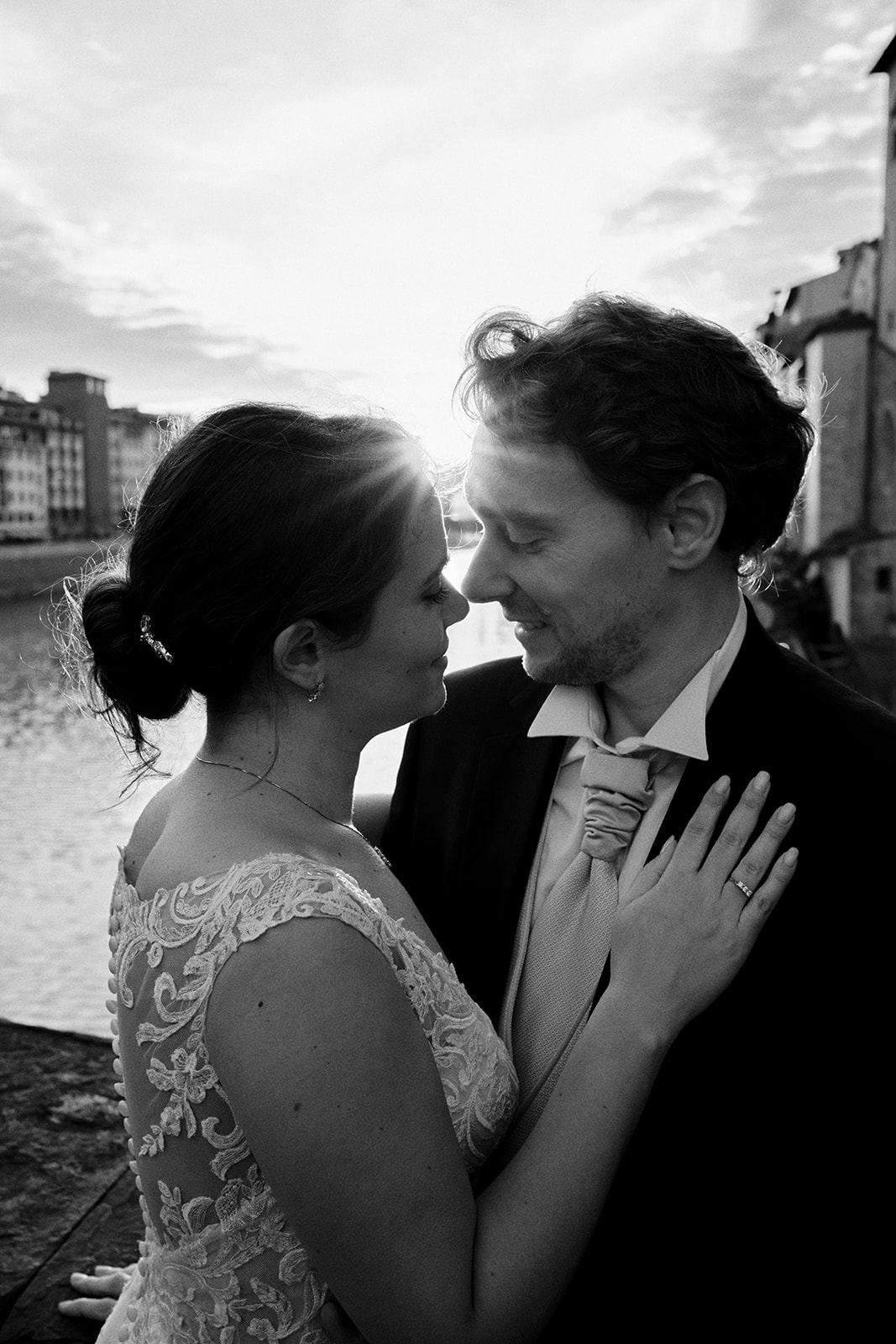 Bride's hand on the groom's chest in the Florence sunrise