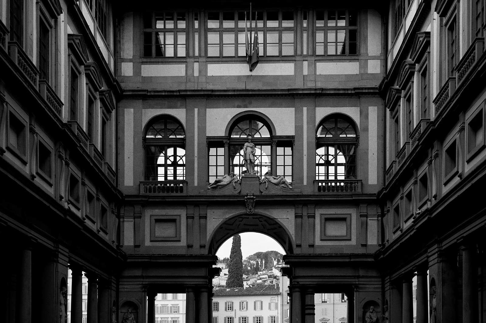 The Uffizi loggia framing the Palazzo Vecchio tower in Florence