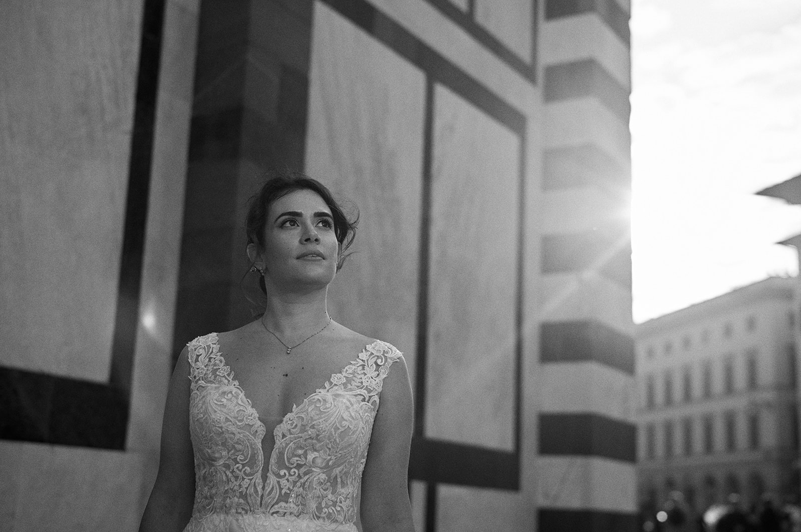 Bride in warm sunrise light against a Florence colonnade
