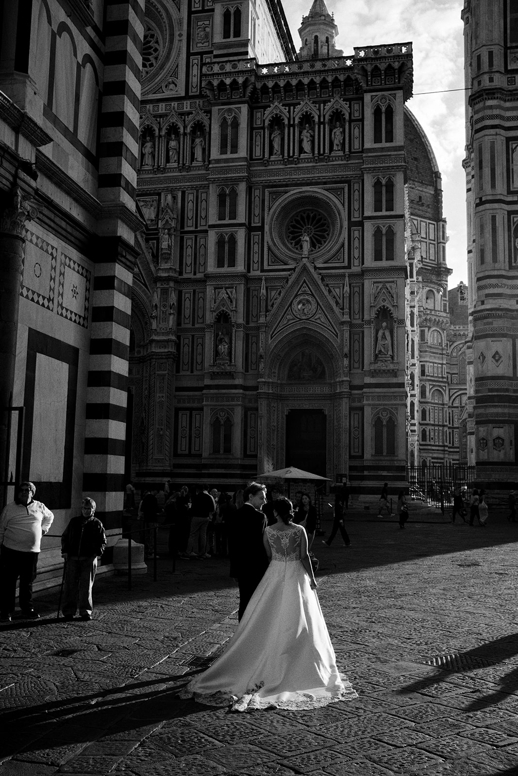 The striped marble facade of the Florence Duomo at sunrise